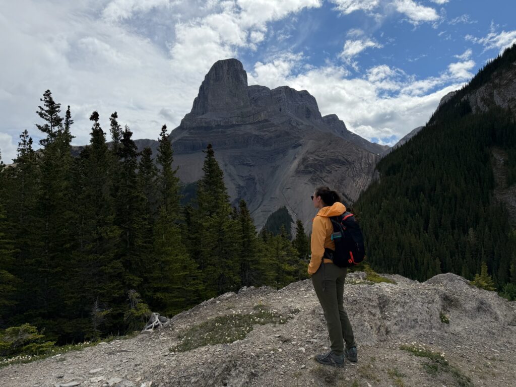 Azul-Sky standing in front of a beautiful mountain in Jasper National Park